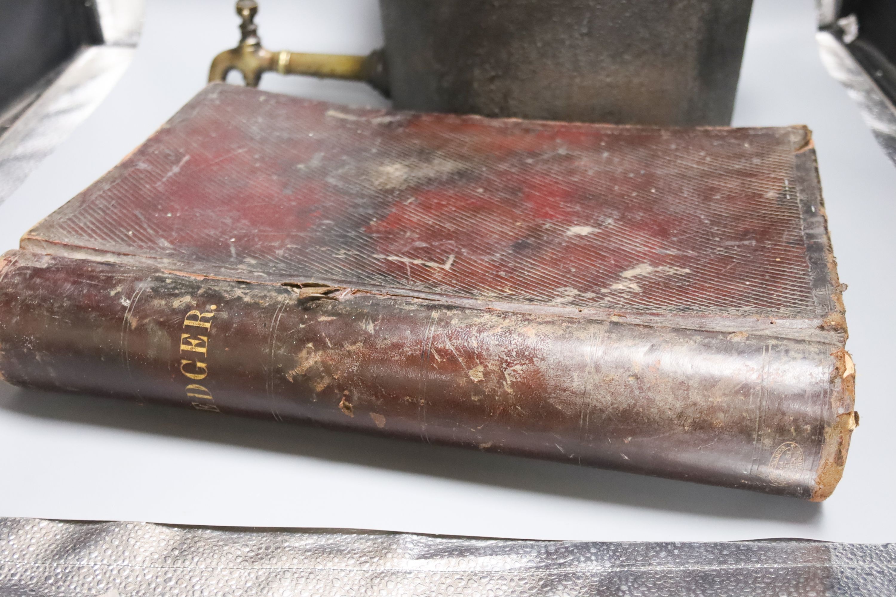 A 19th century tooth extractor, boot pulls, military knives, telescope, leather ledger and iron kettle